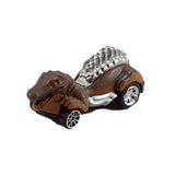 Friction Powered Dinosaur Velociraptor Matchbox Car with Glowing Red Eyes and Silver Accents.